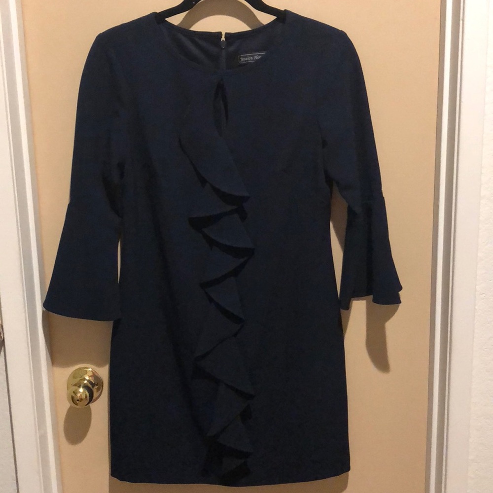 Navy blue dress with bell sleeves.